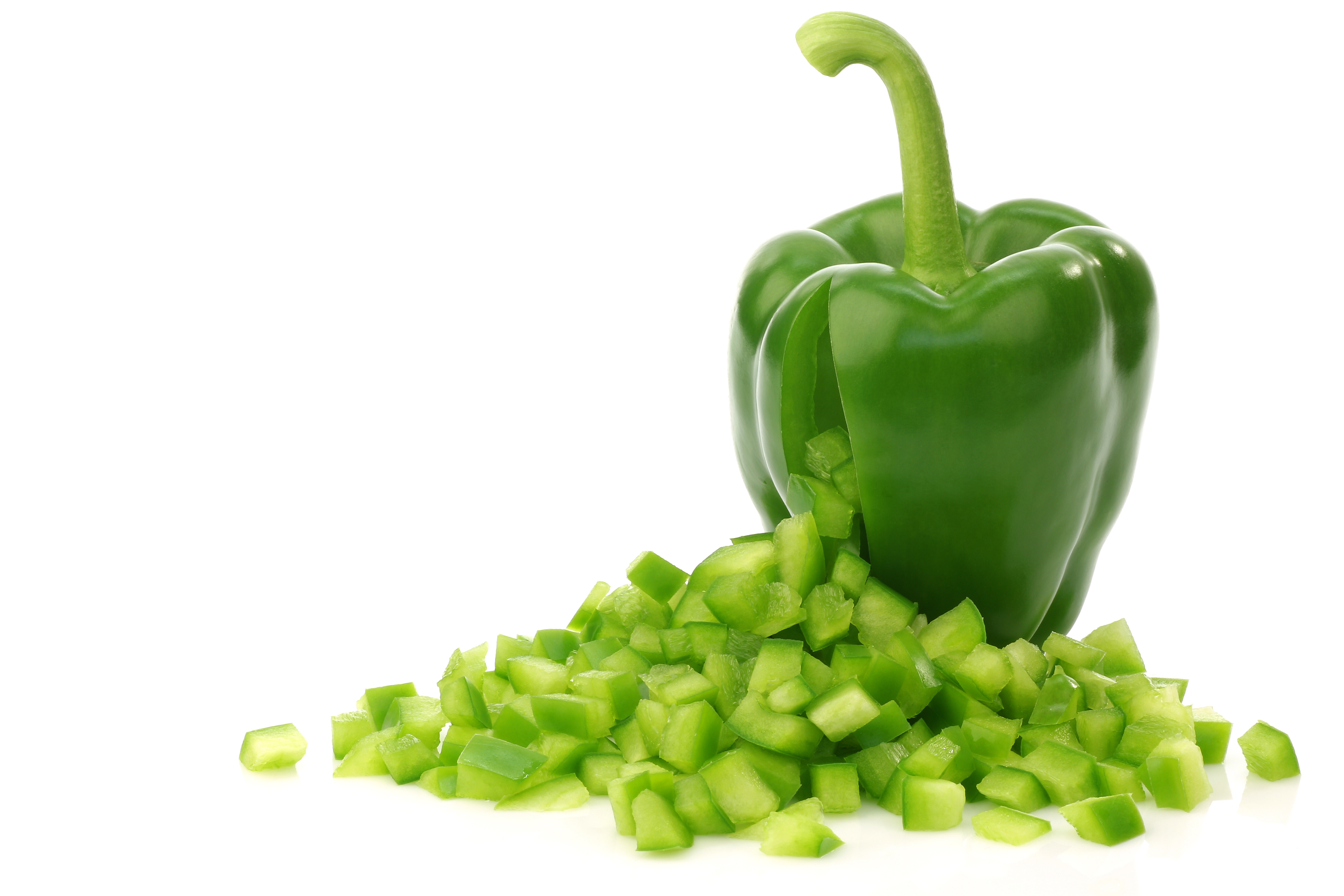 fresh green bell pepper with cut pieces of paprika coming out