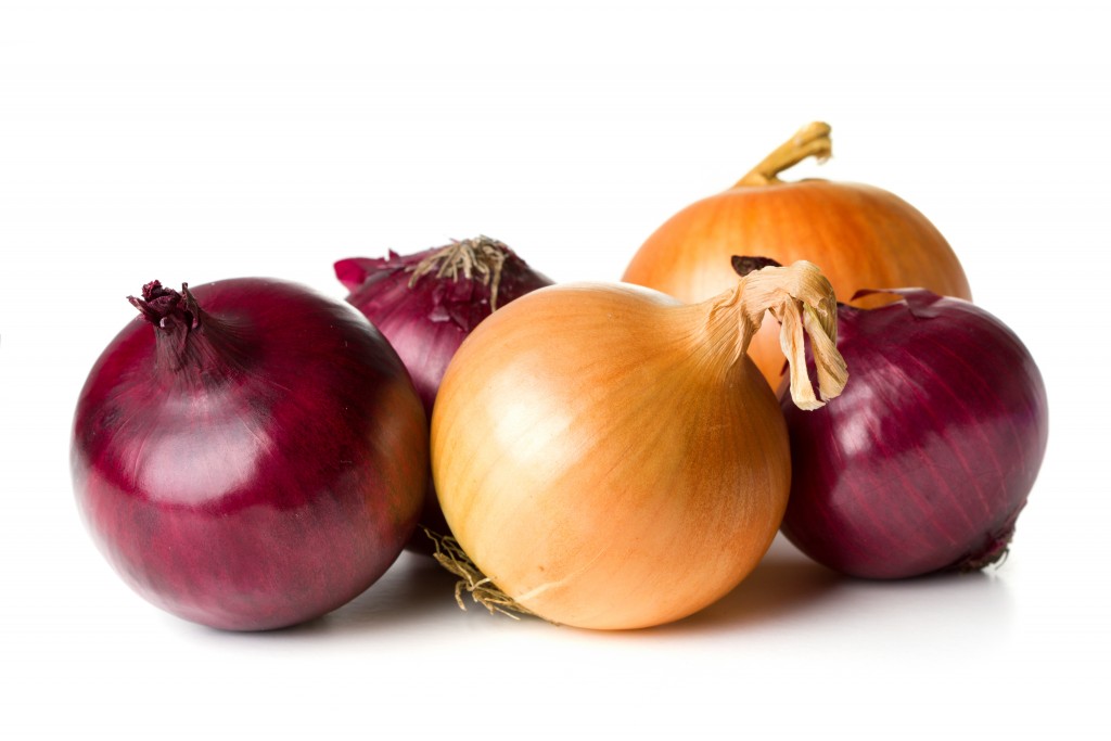 group of purple and yellow onions isolated on white background